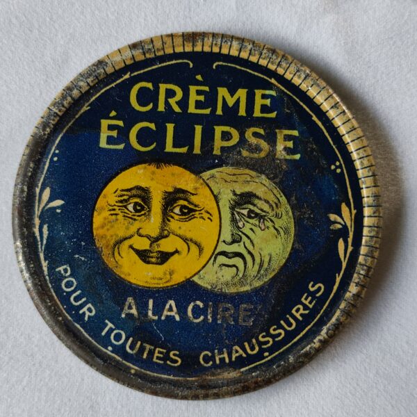 "Crème Eclipse, à la cire, pour toutes chaussures."Jean qui rit, Jean qui pleure". (métal)